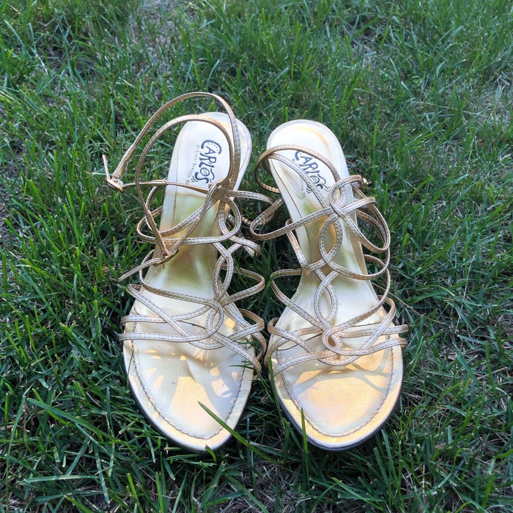 Gold strappy heels by Carlos Santana